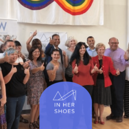 Image of people giving a thumbs up with the In Her Shoes logo