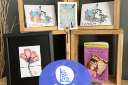 Image of a bunch of art items with local character logo