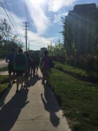 Group walking down a sidewalk