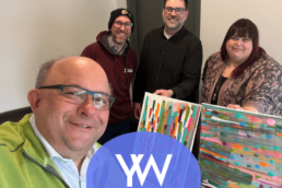 Image of four people and art canvas